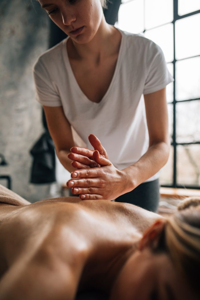 A soothing massage session in a tranquil indoor setting promoting wellness.